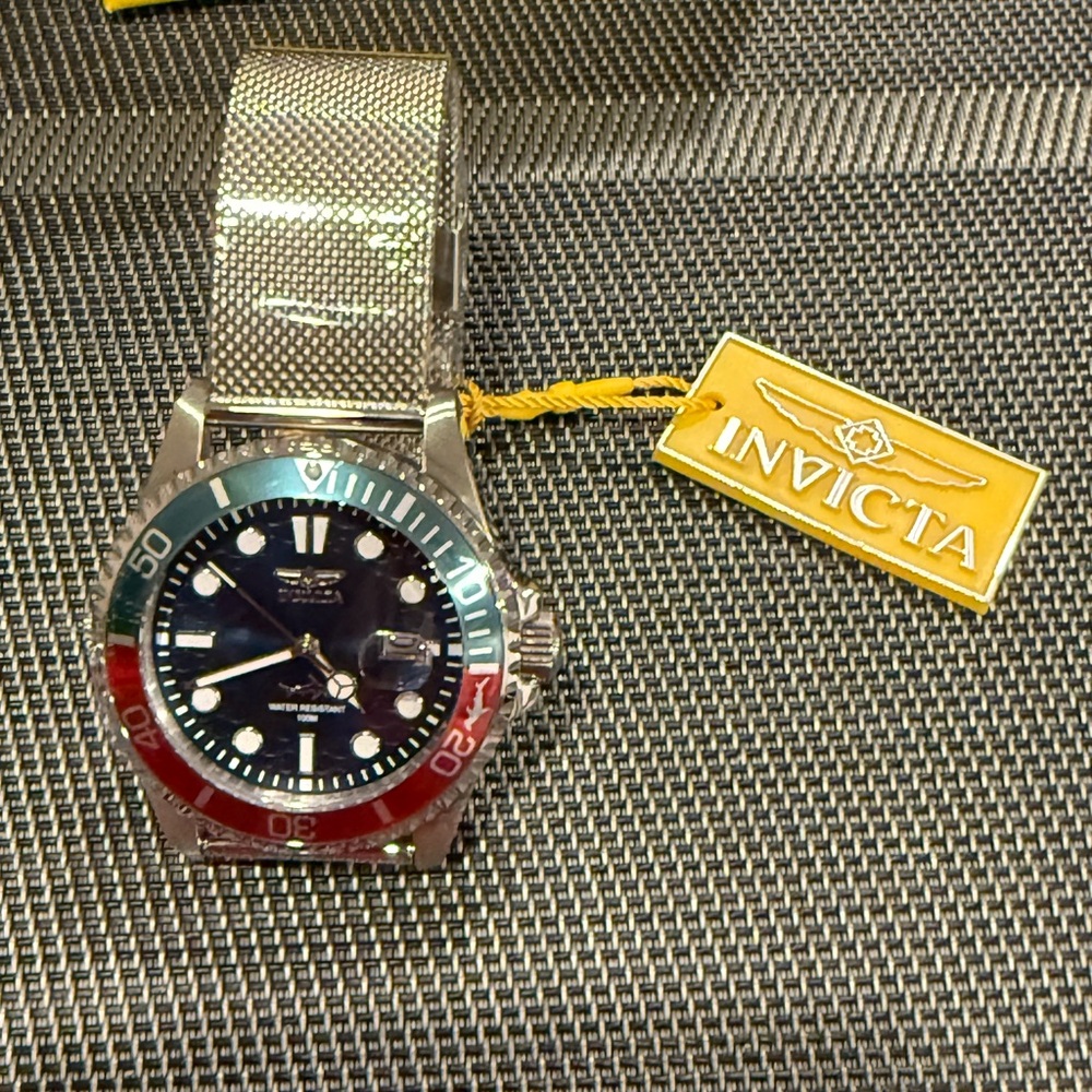 Invicta Silver Watch with Red and Blue Accents